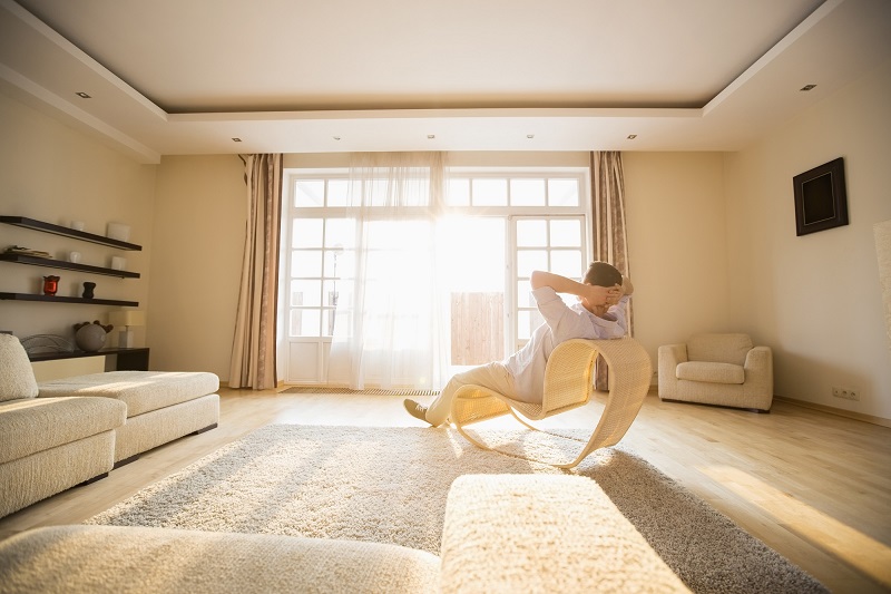 A Man Relaxing in a New Residential Property