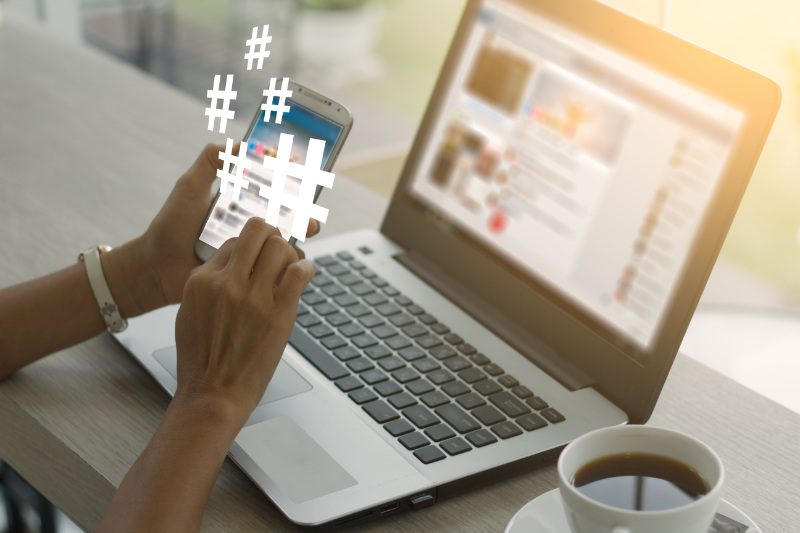 A Realtor Using Social Media Tips for Hashtags to Boost their Marketing and Promo