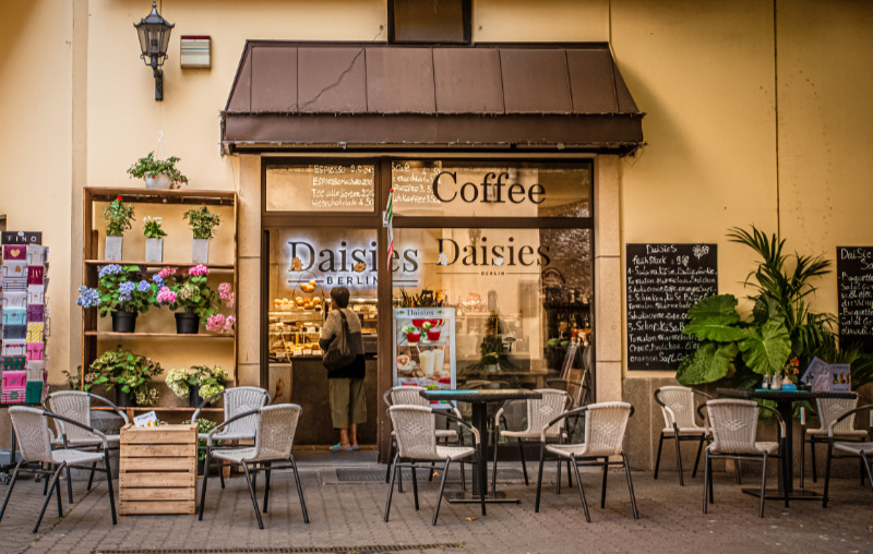 A Photo of a Woman Giving Tips at a Local Coffee Shop that Could be Used by a Realtor for their Social Media Marketing